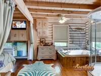 Jacuzzi tub in the bedroom of this cabin near Pigeon Forge